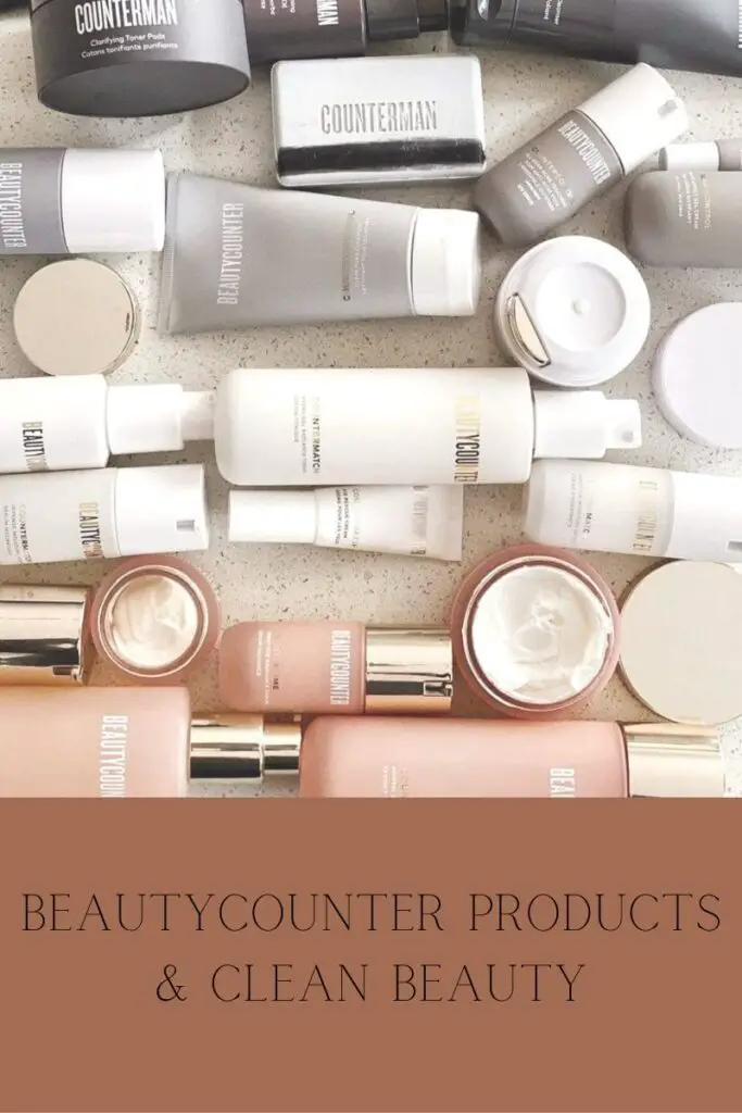 white beautycounter bottles, pink beautycounter bottles, grey beautycounter bottles laying down on  a bathroom counter