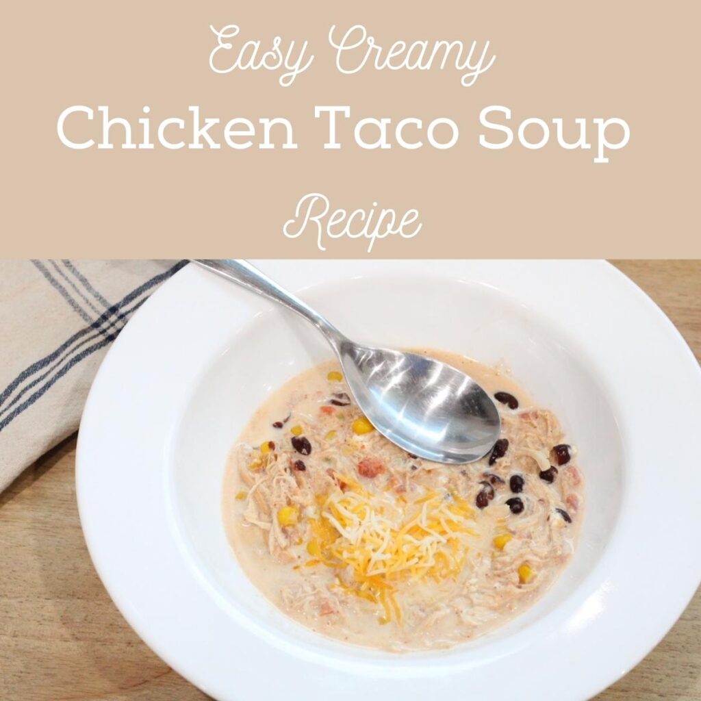 close up of a white bowl with black beans, cheese, onion and a silver spoon in it, with text that says easy creamy chicken taco soup recipe