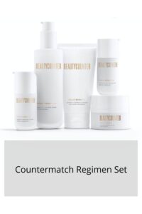 five white bottles of beautycounter countermatch regimen set stacked together for display