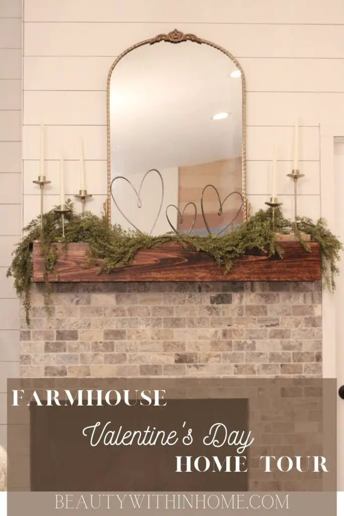 fireplace mantel with gold mirror and black hearts and candles