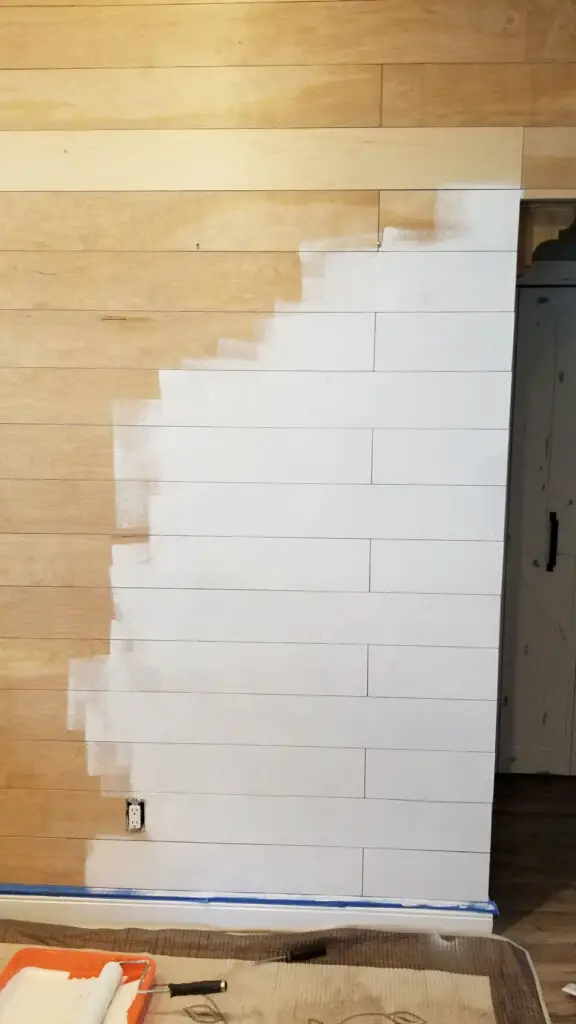 DIY Shiplap boards that are stained and white in color