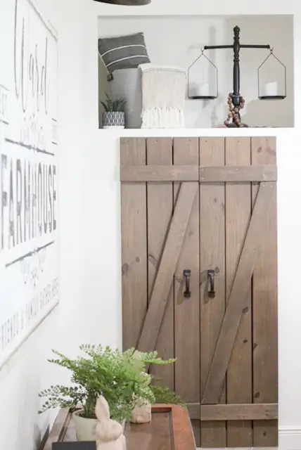 brown shutters turned into barndoor with candles and accessories