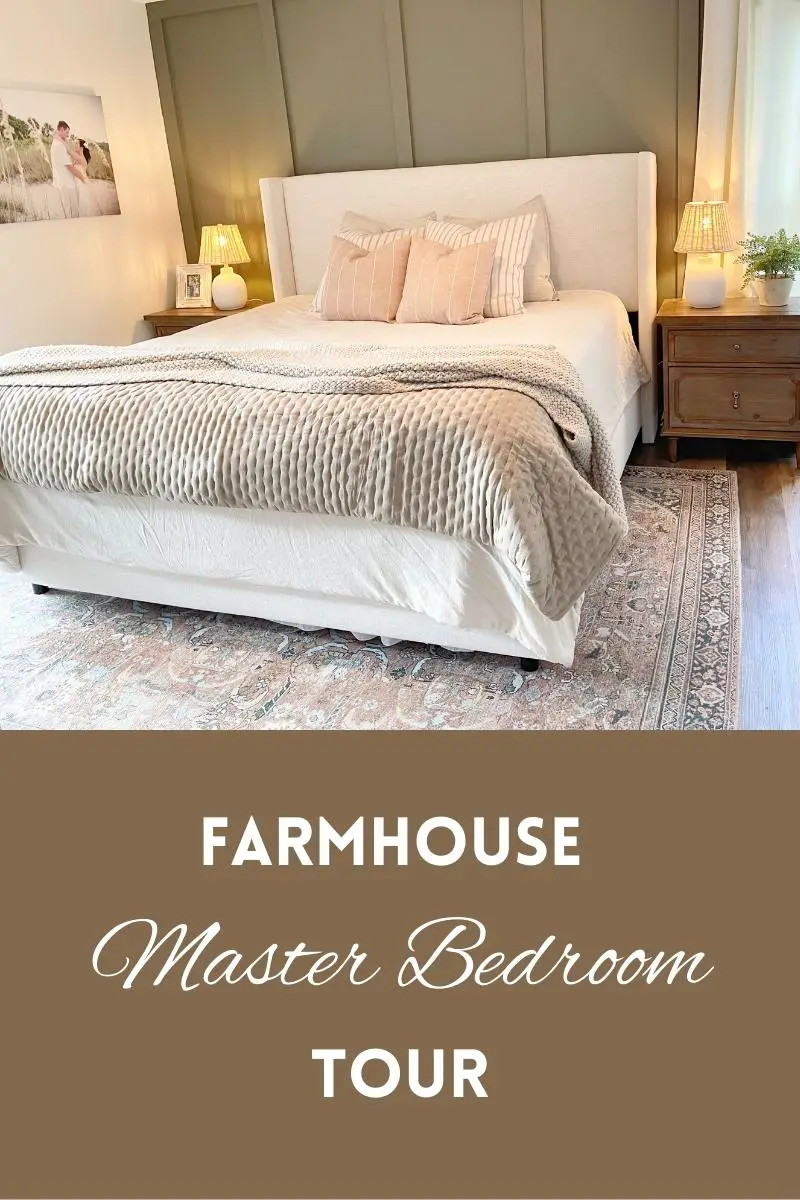 Green board and batten accent wall with a white linen king bed in front of it. A brown wood nightstand next to the bed. A orange, green, ivory patterned area rug underneath the bed. At the bottom are the words "Farmhouse Master Bedroom Tour"